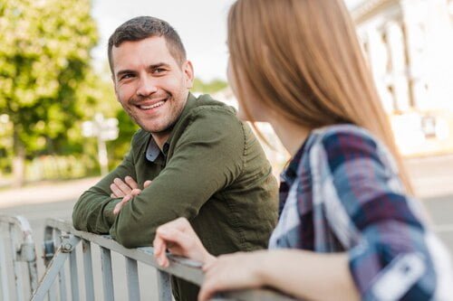 Top 5 Reasons for Painful Twin Flame Cheating 11 couple standing near railing looking each other 23 2148193894 1